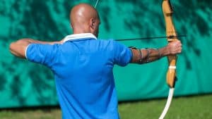 a man shooting his recurve bow