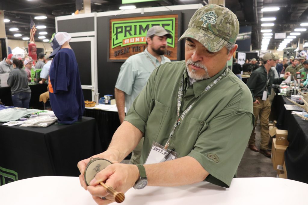 A man showing a turkey call 