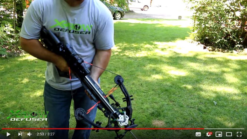 a man holding a crossbow