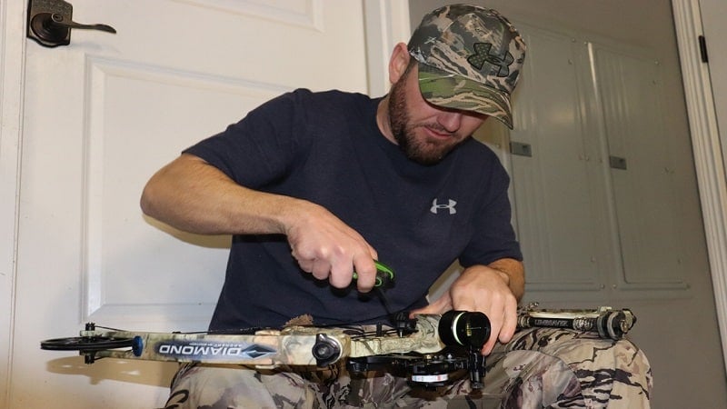 a man working on his bow 