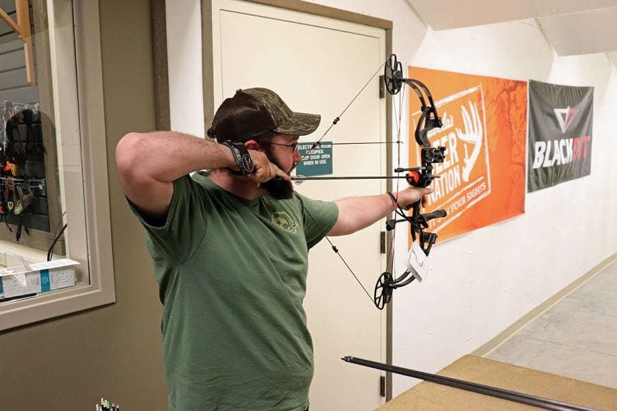 man shooting the Bear Archery Cruzer G 2 Compound Bow