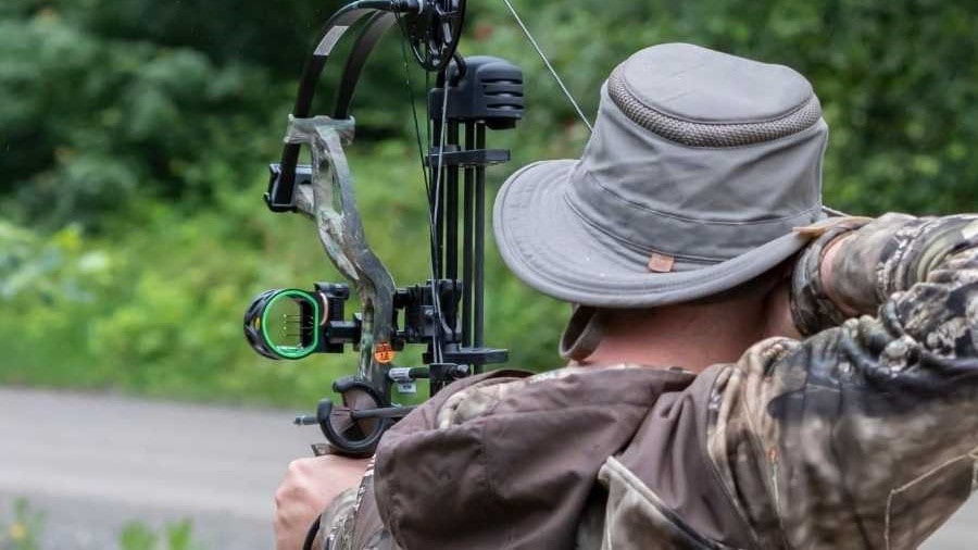 A Hunter shooting a compound bow