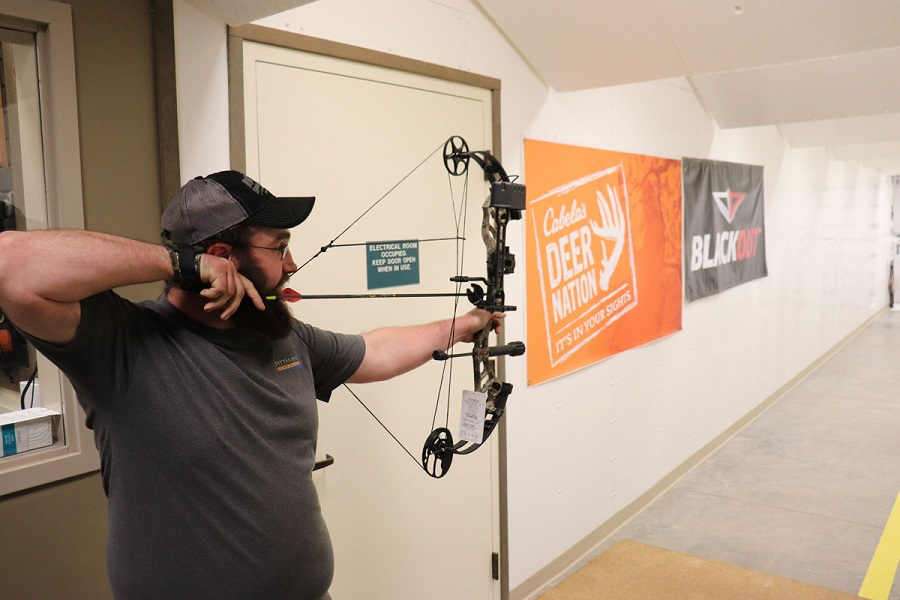 man shooting a bow