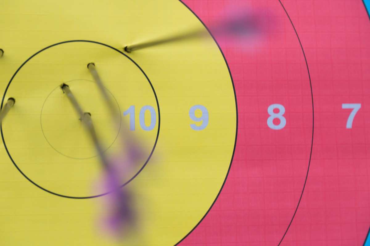 an archery target with arrows in in