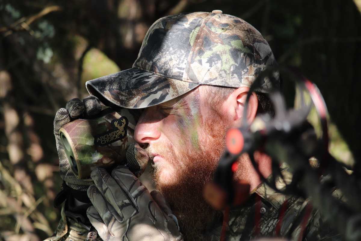a hunter using his rangefinder