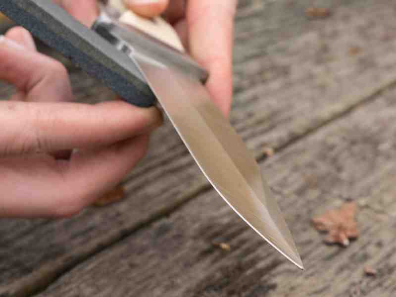 sharpening a knife with a sharpening stone