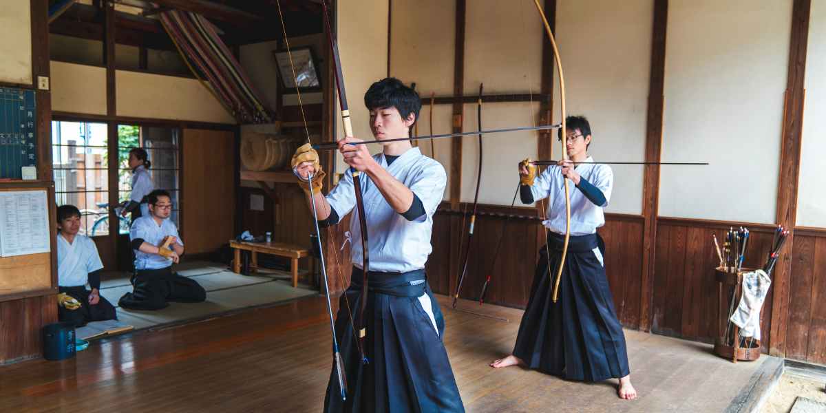 Traditional Japanese archers ready their bows